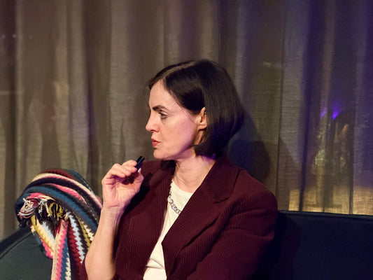 Prof. Dr. Maike Rabe photographed on Le Black Sofa in conversation on fashion, style and responsible entrepreneurship