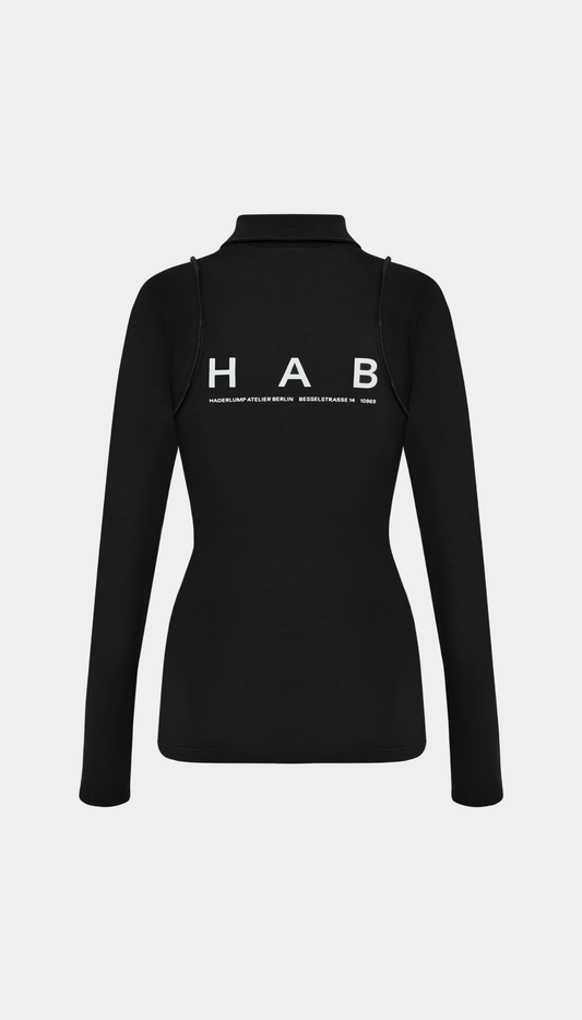A black long-sleeve mock neck top with 'HAB' printed in white across the back, shown on a light gray background.