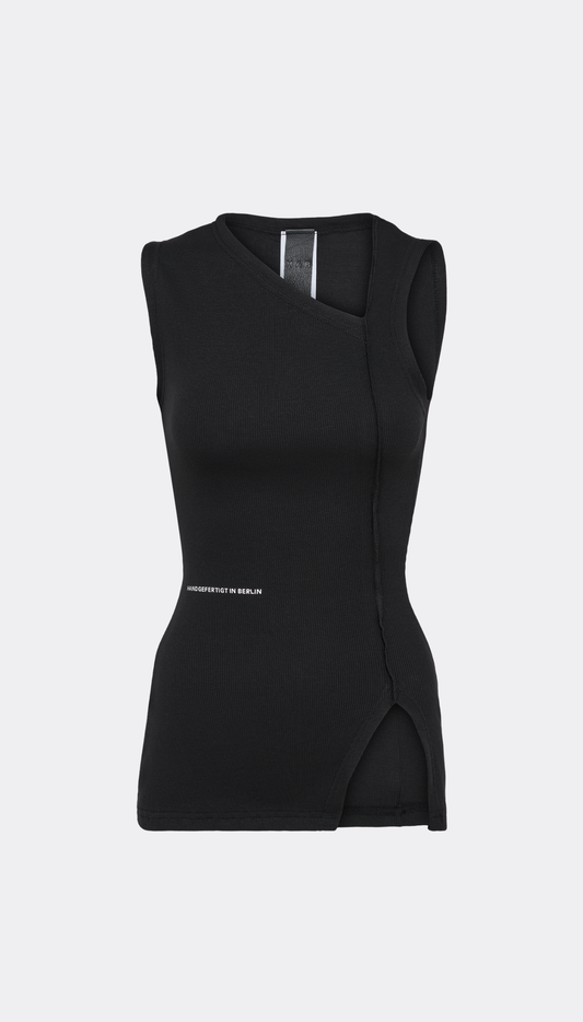 A black sleeveless asymmetrical top with a small white text detail on the lower left side, displayed against a light gray background.