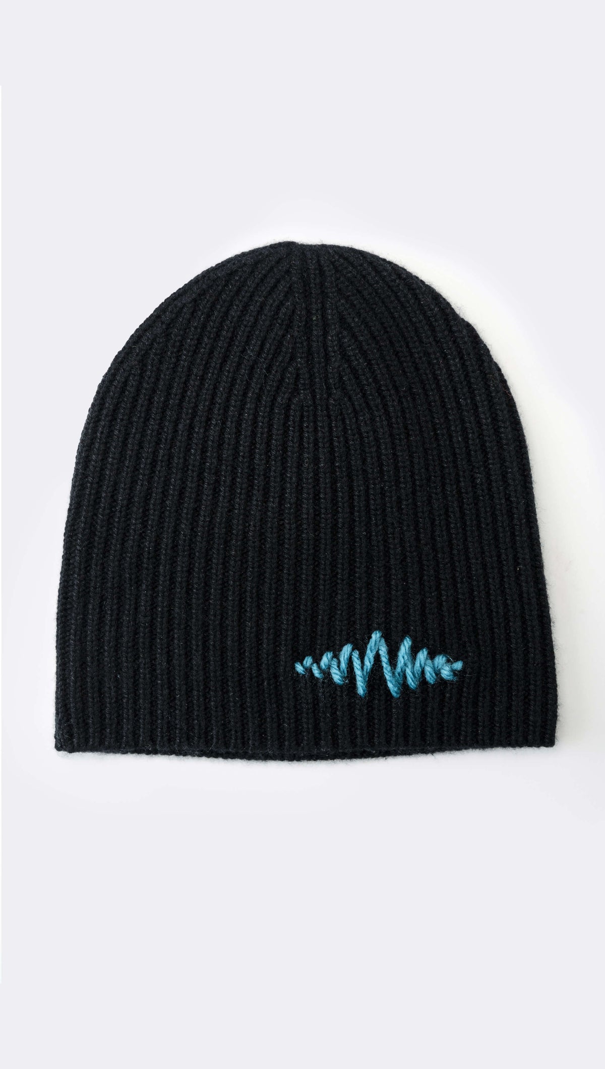 A black ribbed cashmere beanie with a signature logo hand-embroidered in blue on the front.