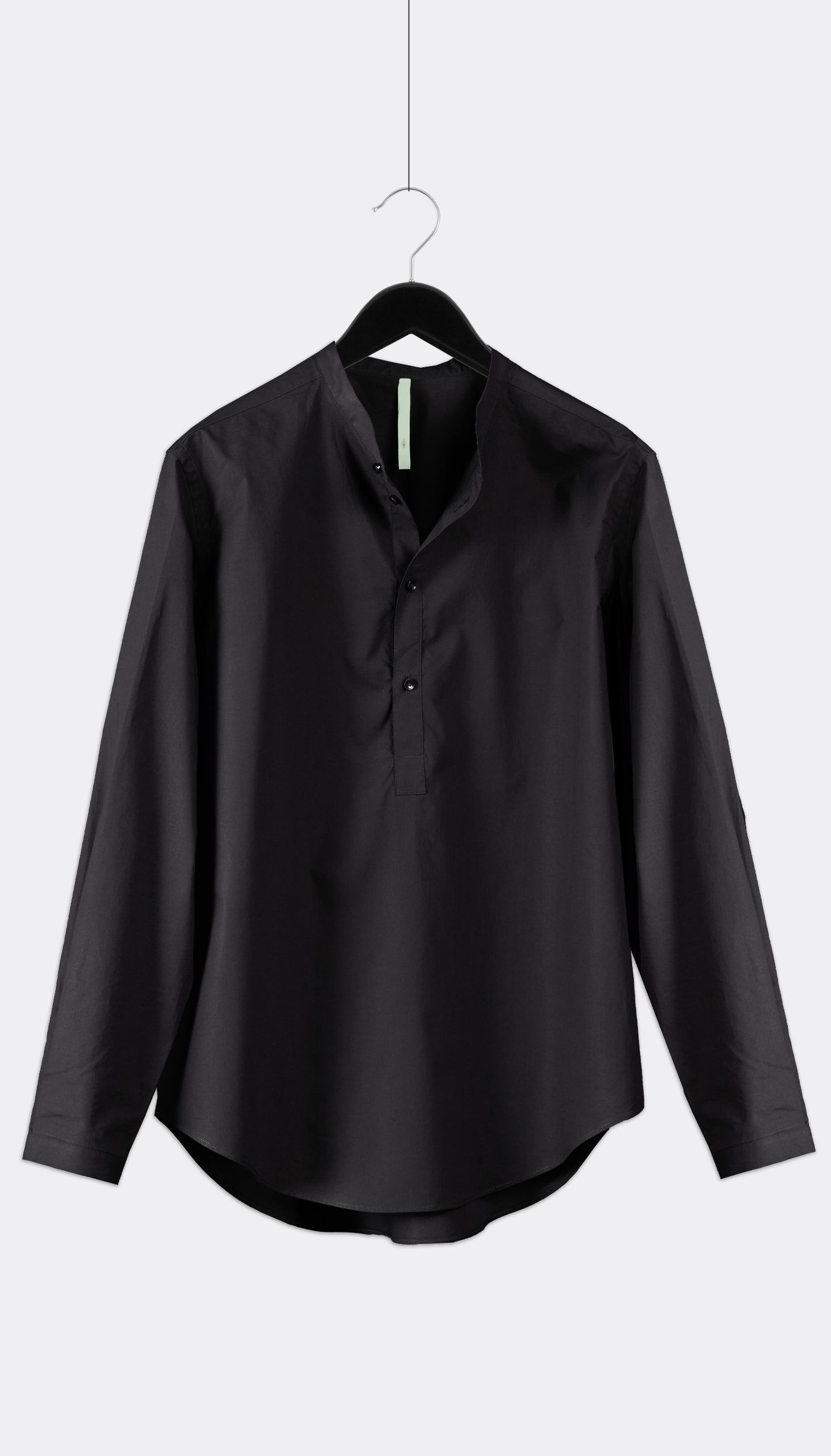 A black long-sleeved shirt with a Mao collar, buttoned cuffs, and a hanger in the background.