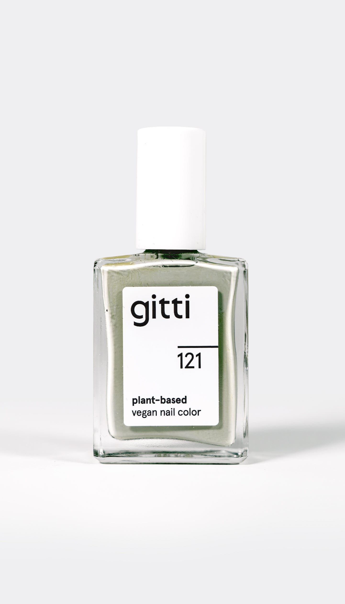 A bottle of gitti brand nail polish labeled 'No. 121 sage green', indicating a plant-based, vegan nail color.