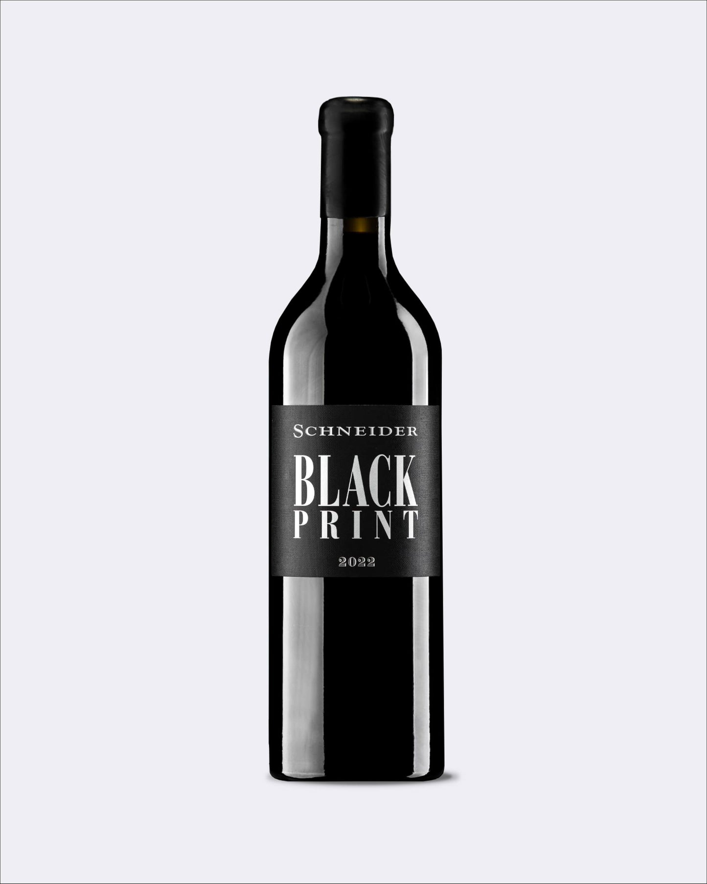 A dark glass wine bottle with a black label reading 'Schneider Black Print 2022' on a light gray background.