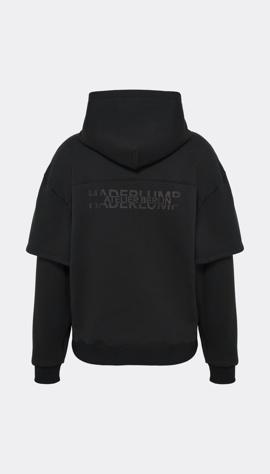 Detail of black Haderlump Hoodie logo print on back 