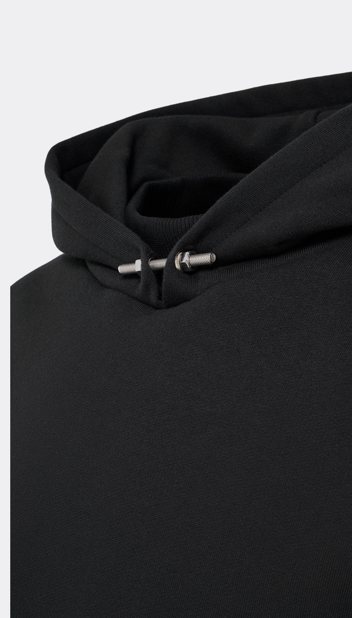 Close-up of a black hooded sweatshirt with a silver metal screw on the hood, shown against a light gray background.