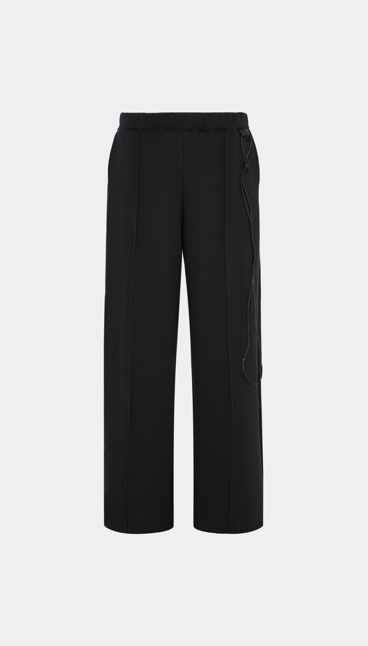 Black "Sunday Pants" with a drawstring waist, shown flat against a light gray background.