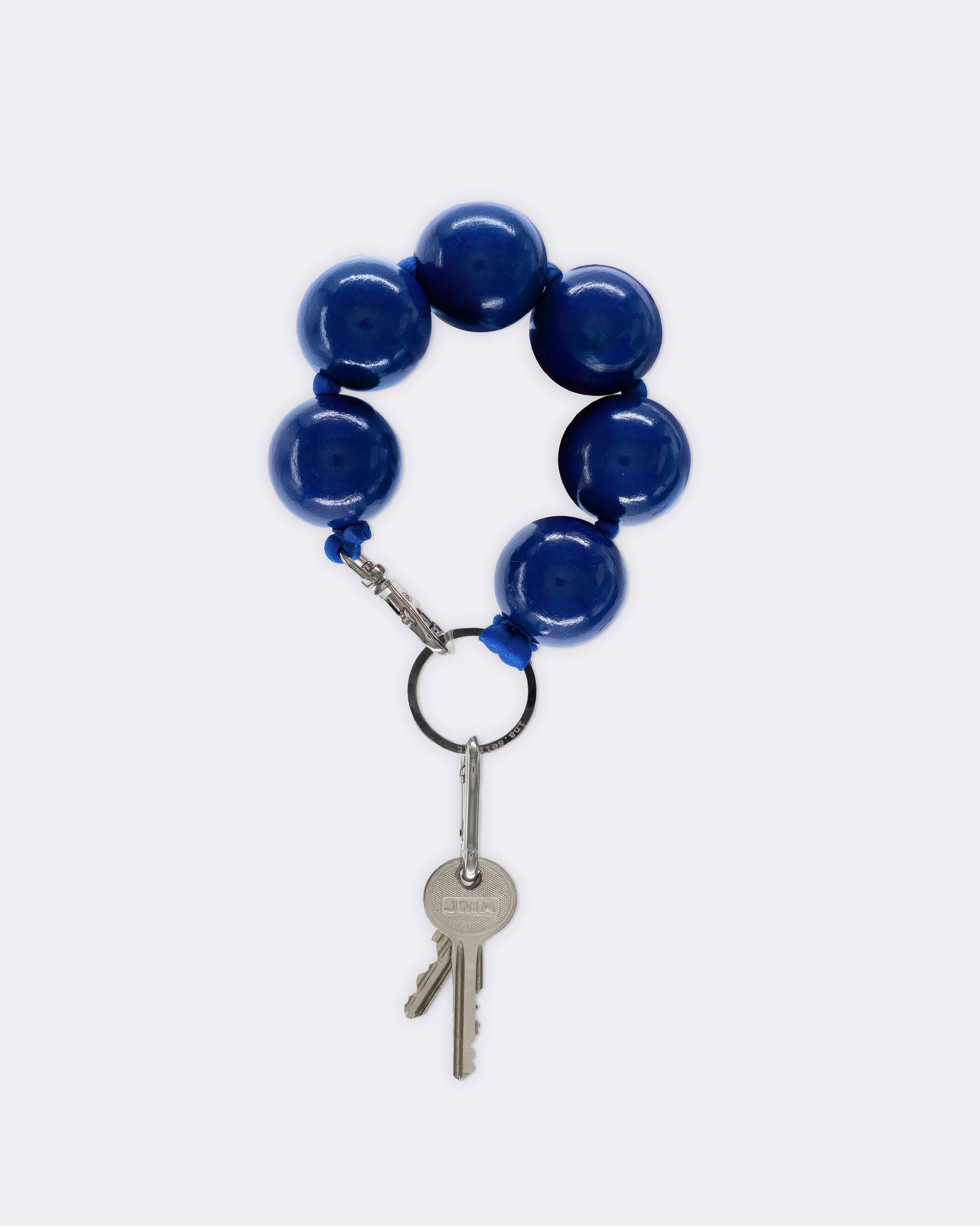Blue beaded keychain with a key on a white background