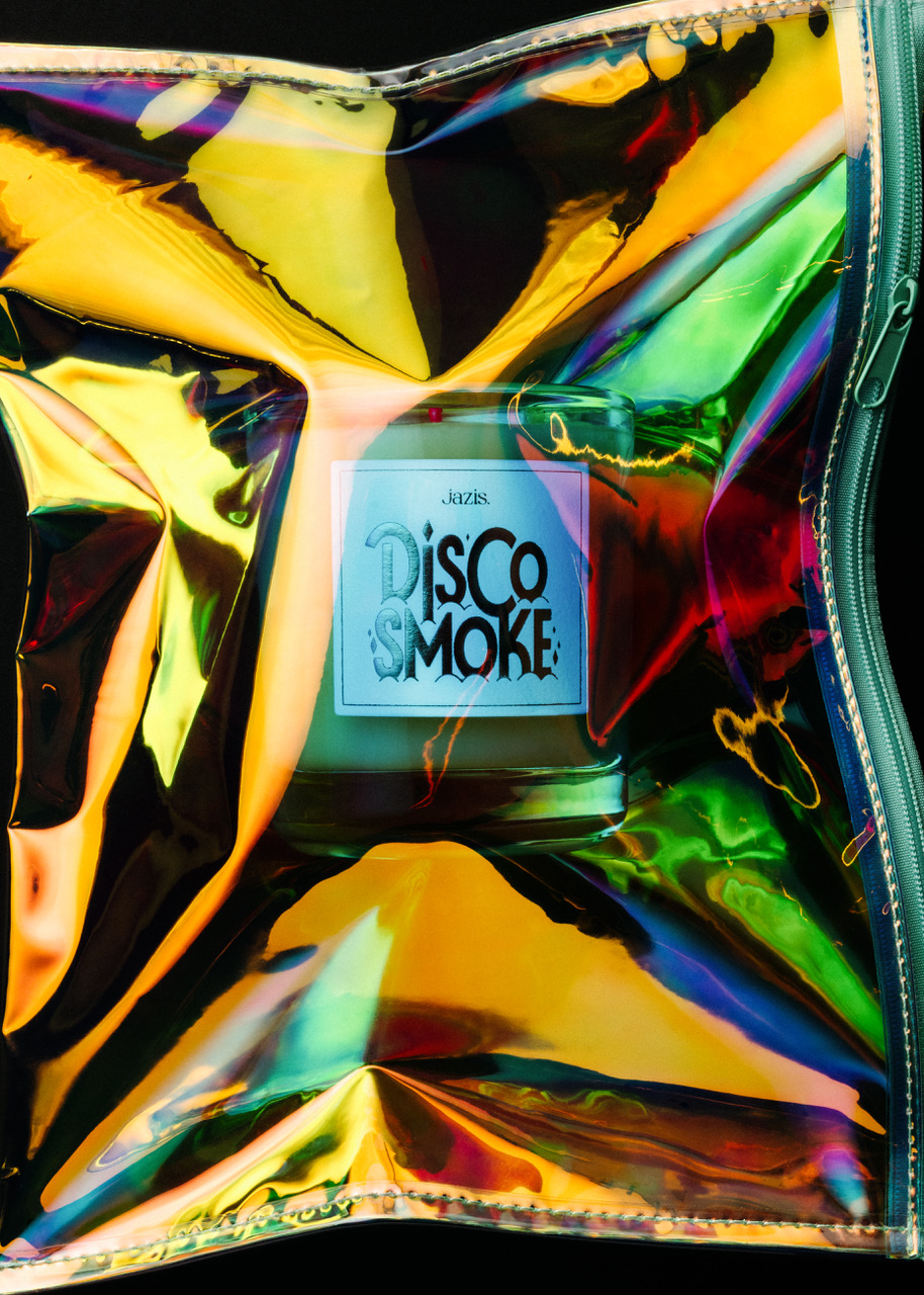 Colorful metallic bag with a candle labeled 'Disco Smoke' inside