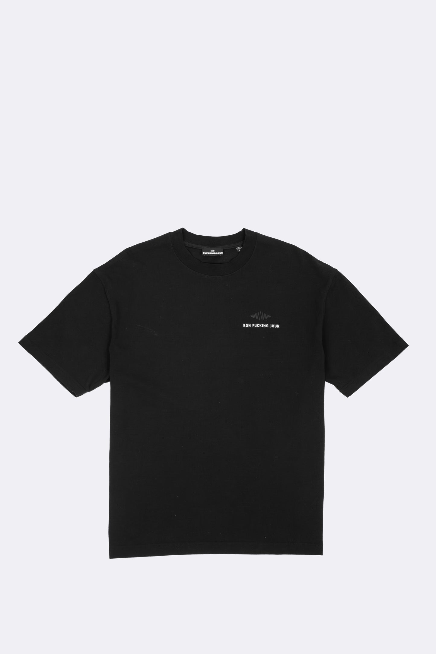 Black t-shirt with a white print on a light gray background