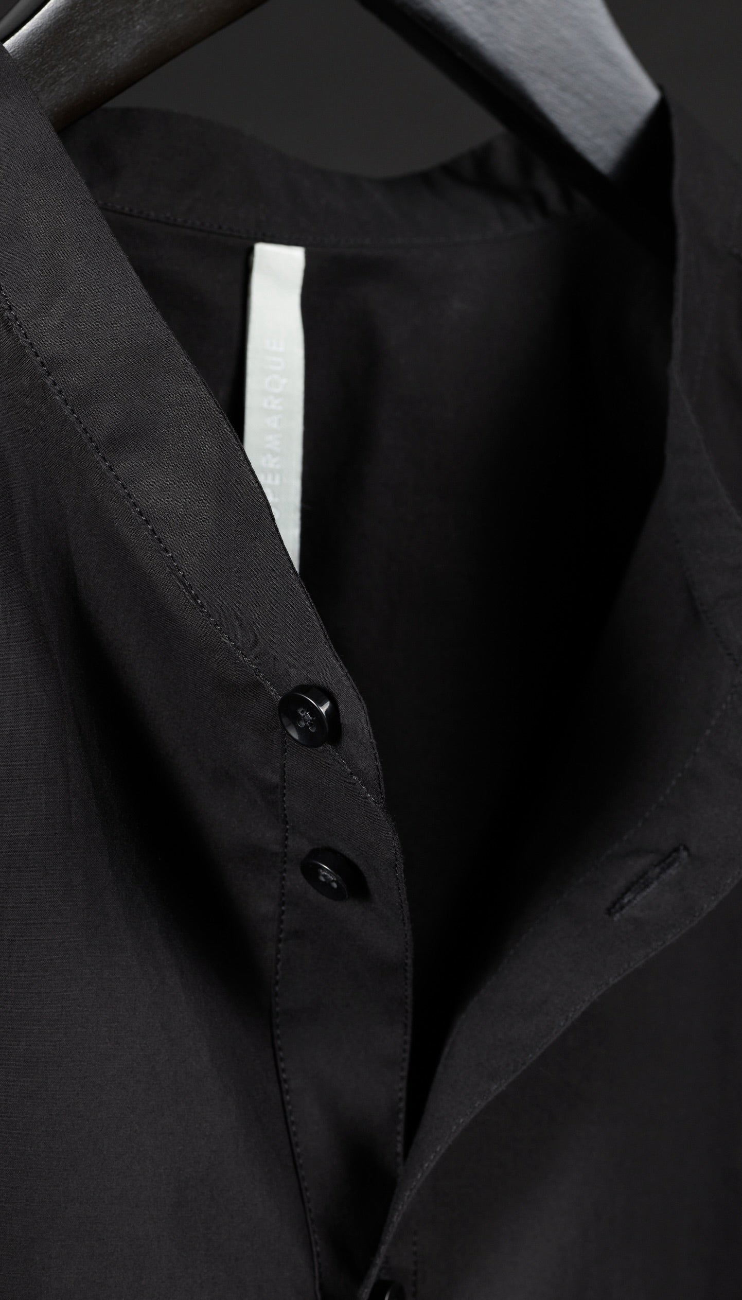 Detail of Le Mao black shirt