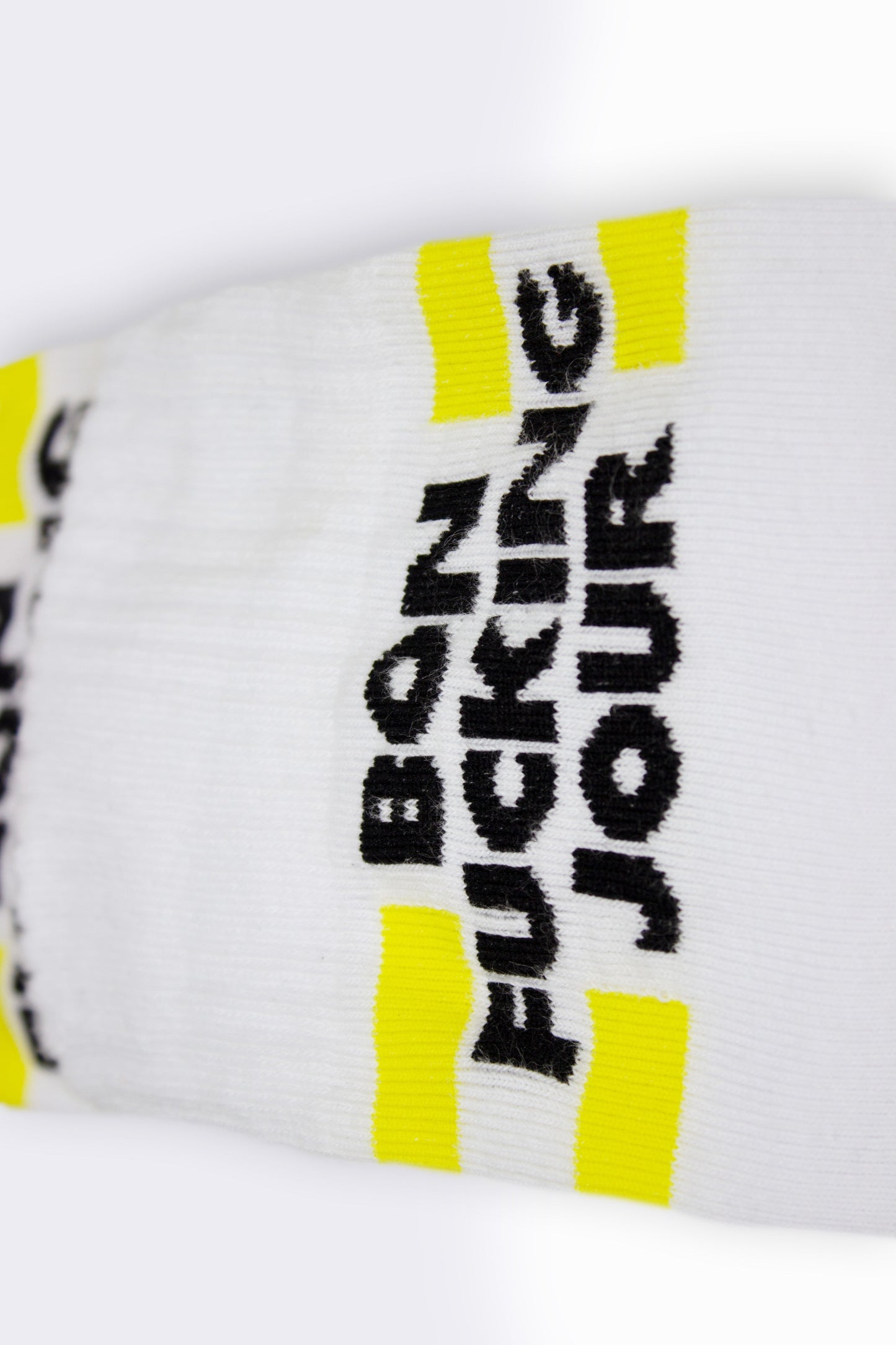 White sock with black text and yellow accents on a white background