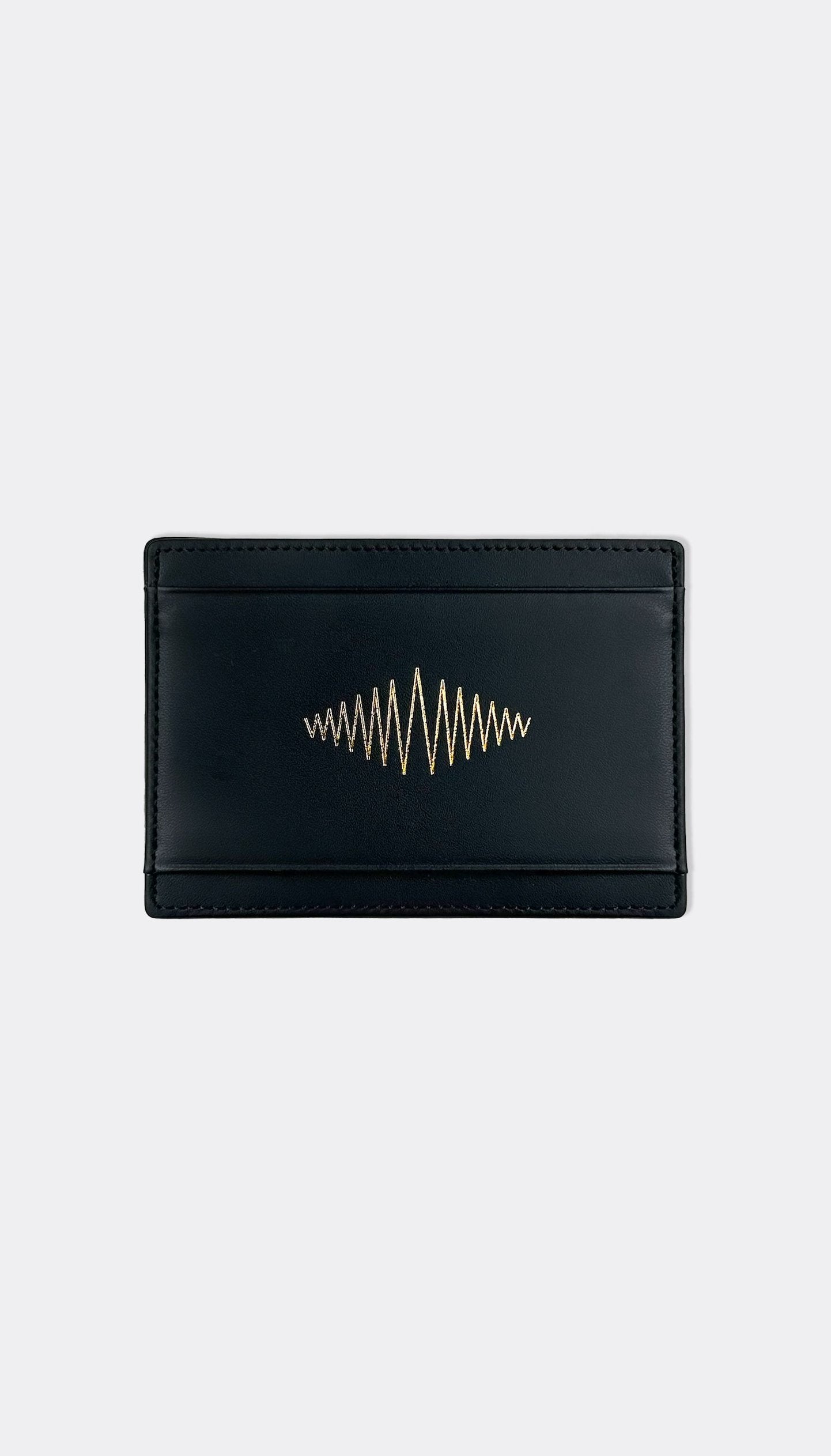A black leather wallet with subtle embossed SUPERMARQUE branding