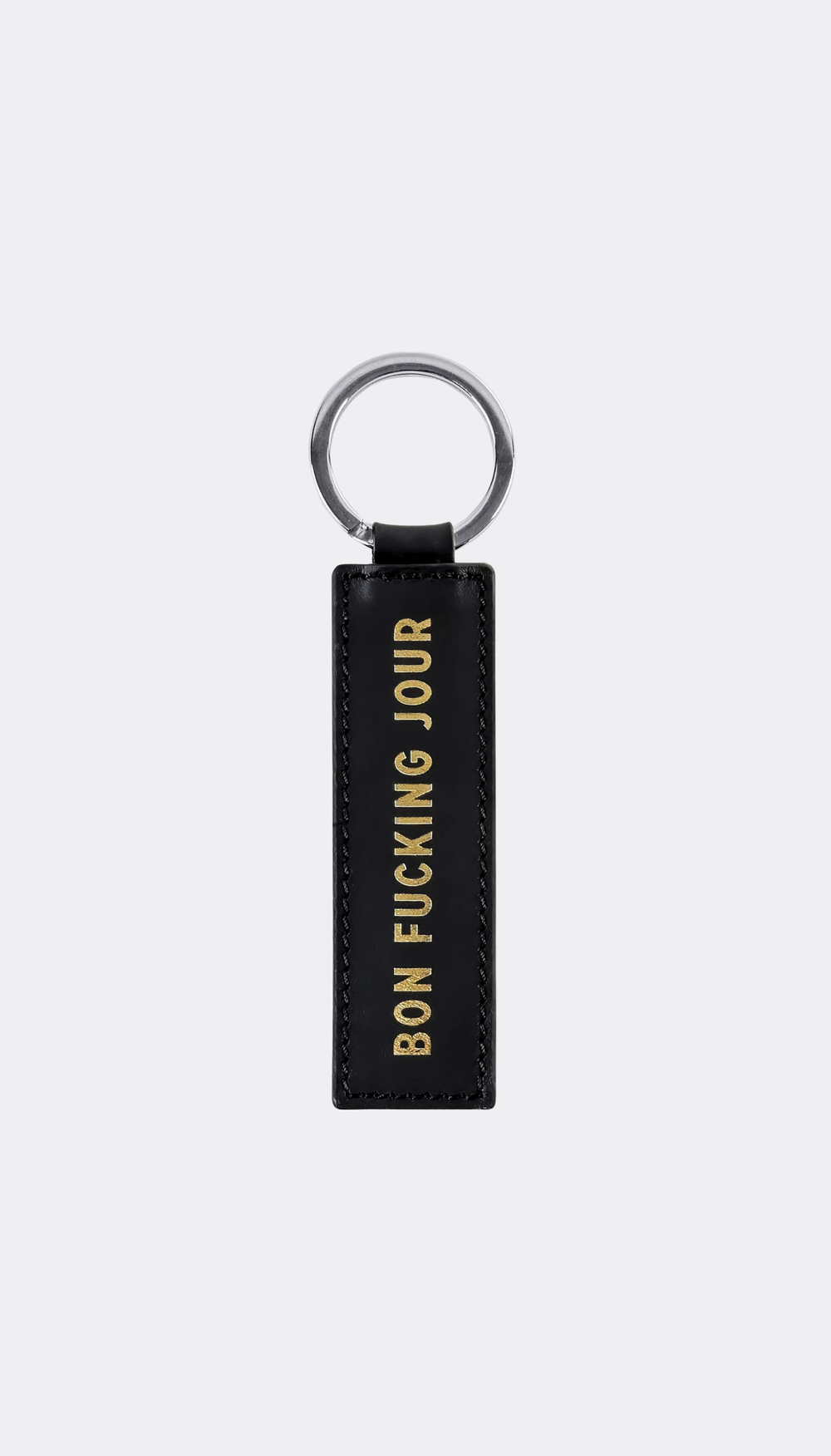 Keychain by SUPERMARQUE with gold engraving saying Bon Fucking Jour